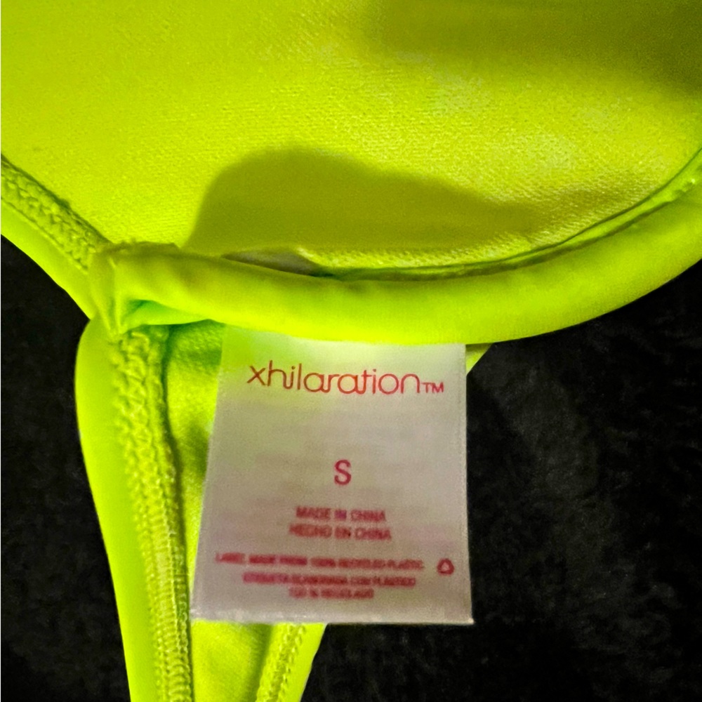 This is a small neon greenish yellow bathing suit top, from xhilaration